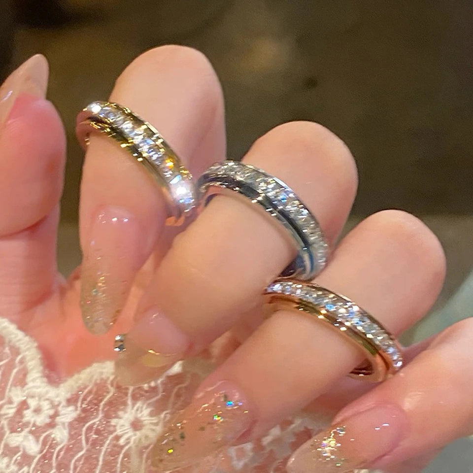 Ring i rustfrit stål enkelt række firkantet zirkon roterende ring krystal CZ smykke TikTok viral gaveidé 2026