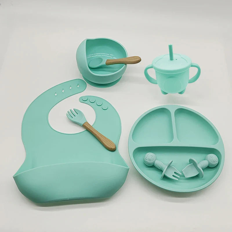 Baby-Silikon-Geschirrset 8-teilig Saugnäpfe Schalen Geteilter Teller Lätzchen Löffel Gabel Fall 2025 Selbstfütterungshilfe