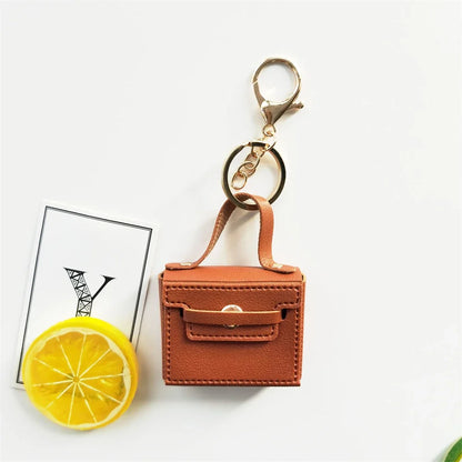 1+1 Gratis Birkin Inspiriert Mini Handtasche - Einfarbige PU Leder Münztasche Schlüsselanhänger Charm