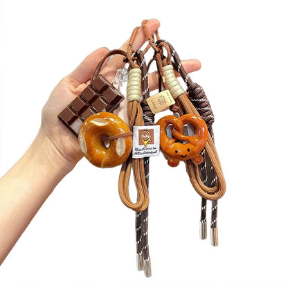 Vävda rep rosettnyckelring med söta bakverksberlocker